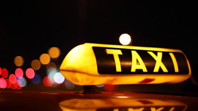 Taxi sign at night