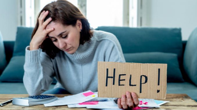 Upset young woman asking for help in paying bills Mortgage home or business finance problems