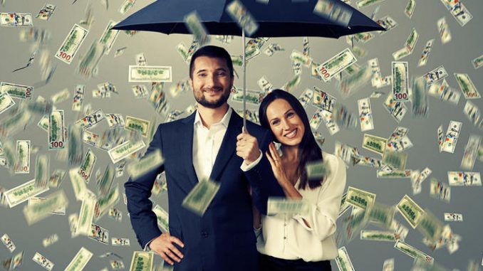 couple under money rain