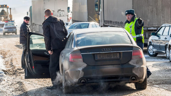 Police officer has stopped driver on road