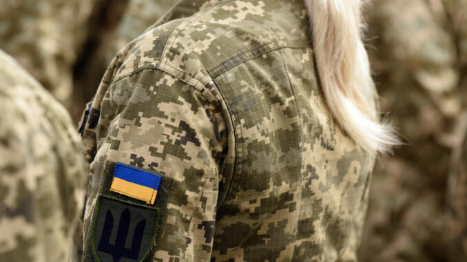 Woman soldier. Woman in army. Ukraine military uniform. Ukrainia
