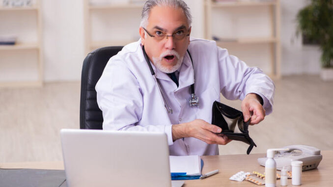 Experienced male doctor in remuneration concept
