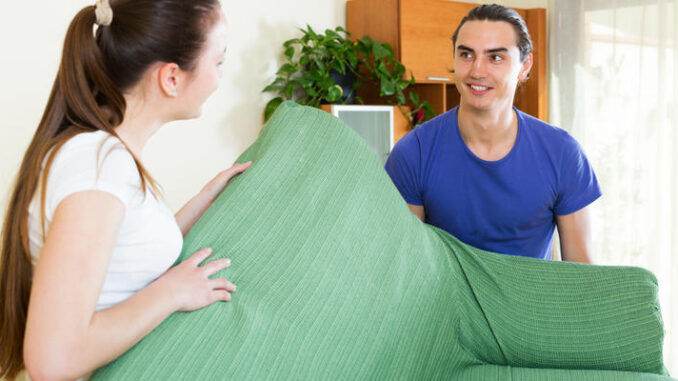 Couple doing relocation of furniture